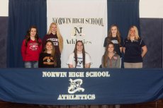 Six Norwin girls soccer players signed their letters of intent to play in college next season. Standings (from left to right) are Abbey Tarosky (St. Francis), Jessica Boytim (Virginia Tech), Marley Smith (Duquesne) and Norwin girls soccer coach Lauren Karcher. Seated are Taylor Crupie (Seton Hill), Nikki Grzebyk (Westminster) and Micayla Livingston (Dayton).